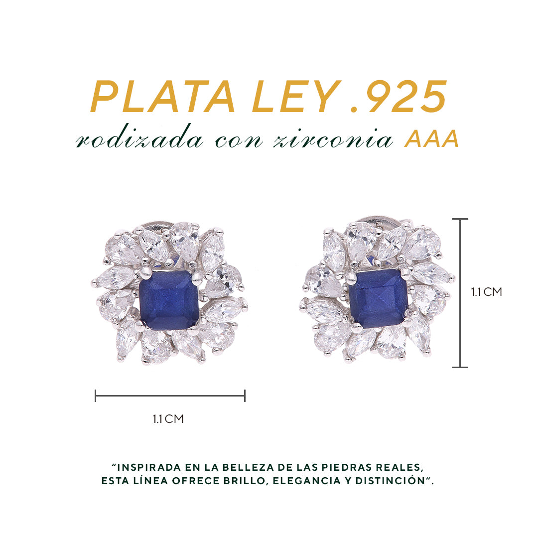 BROQUEL EN PLATA LEY .925, CON RODIO , ZIRCONIA AAA AZUL ZAFIRO Y BLANCO  , EN FORMA DE FLOR