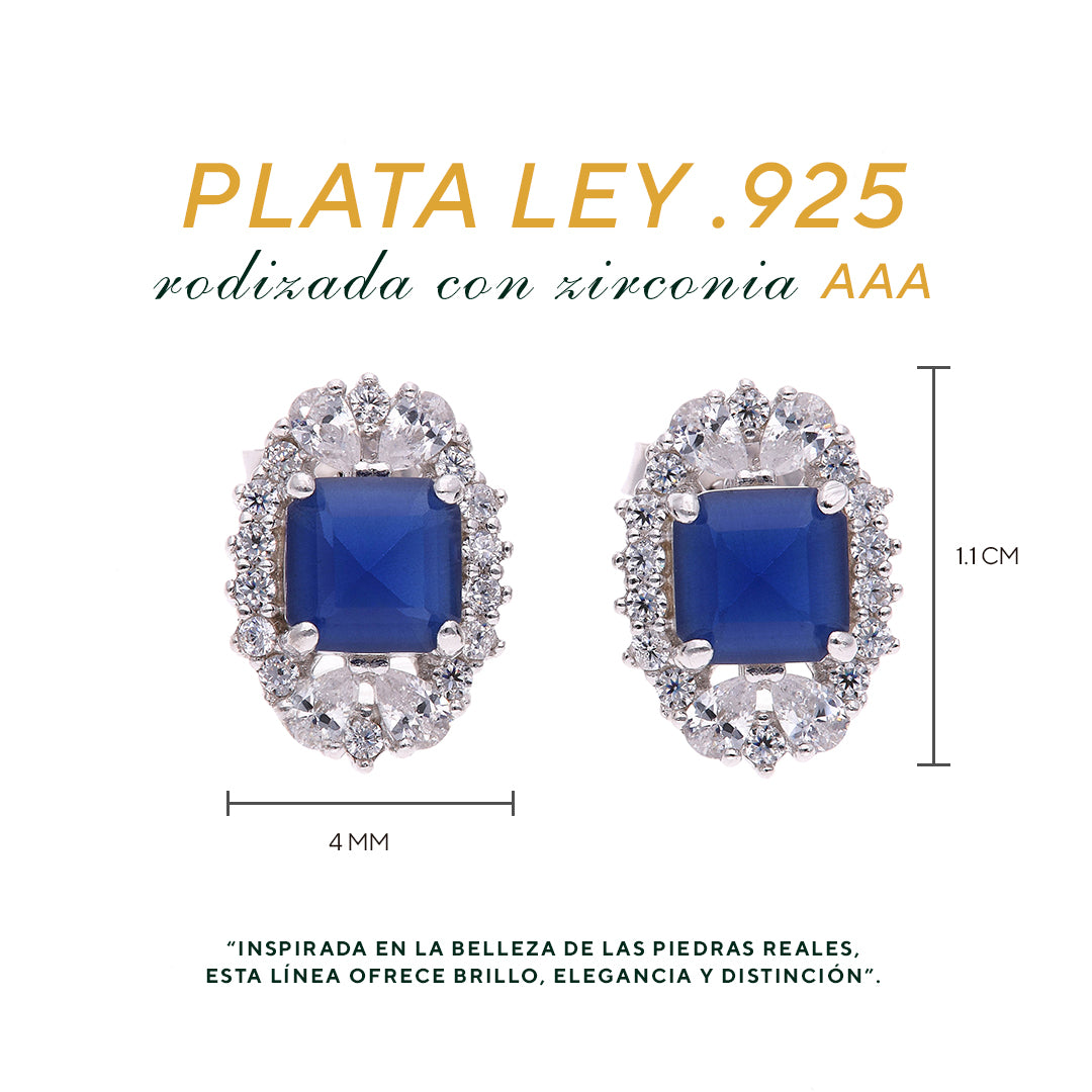 BROQUEL EN PLATA LEY .925, CON RODIO , ZIRCONIA AAA AZUL ZAFIRO Y BLANCO  , EN FORMA DE FLOR