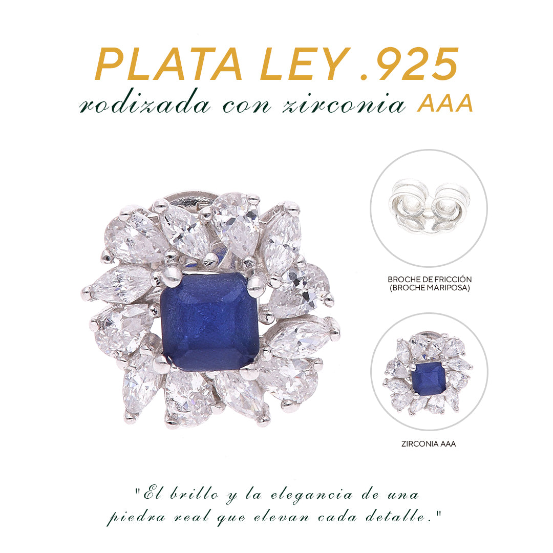 BROQUEL EN PLATA LEY .925, CON RODIO , ZIRCONIA AAA AZUL ZAFIRO Y BLANCO  , EN FORMA DE FLOR