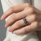 Anillo Plata Ley 925 con Rodio y Zirconia AAA Color Azul Zafiro y Blanco en Forma de Dos Flores