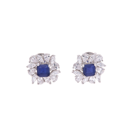 BROQUEL EN PLATA LEY .925, CON RODIO , ZIRCONIA AAA AZUL ZAFIRO Y BLANCO  , EN FORMA DE FLOR