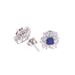 BROQUEL EN PLATA LEY .925, CON RODIO , ZIRCONIA AAA AZUL ZAFIRO Y BLANCO  , EN FORMA DE FLOR