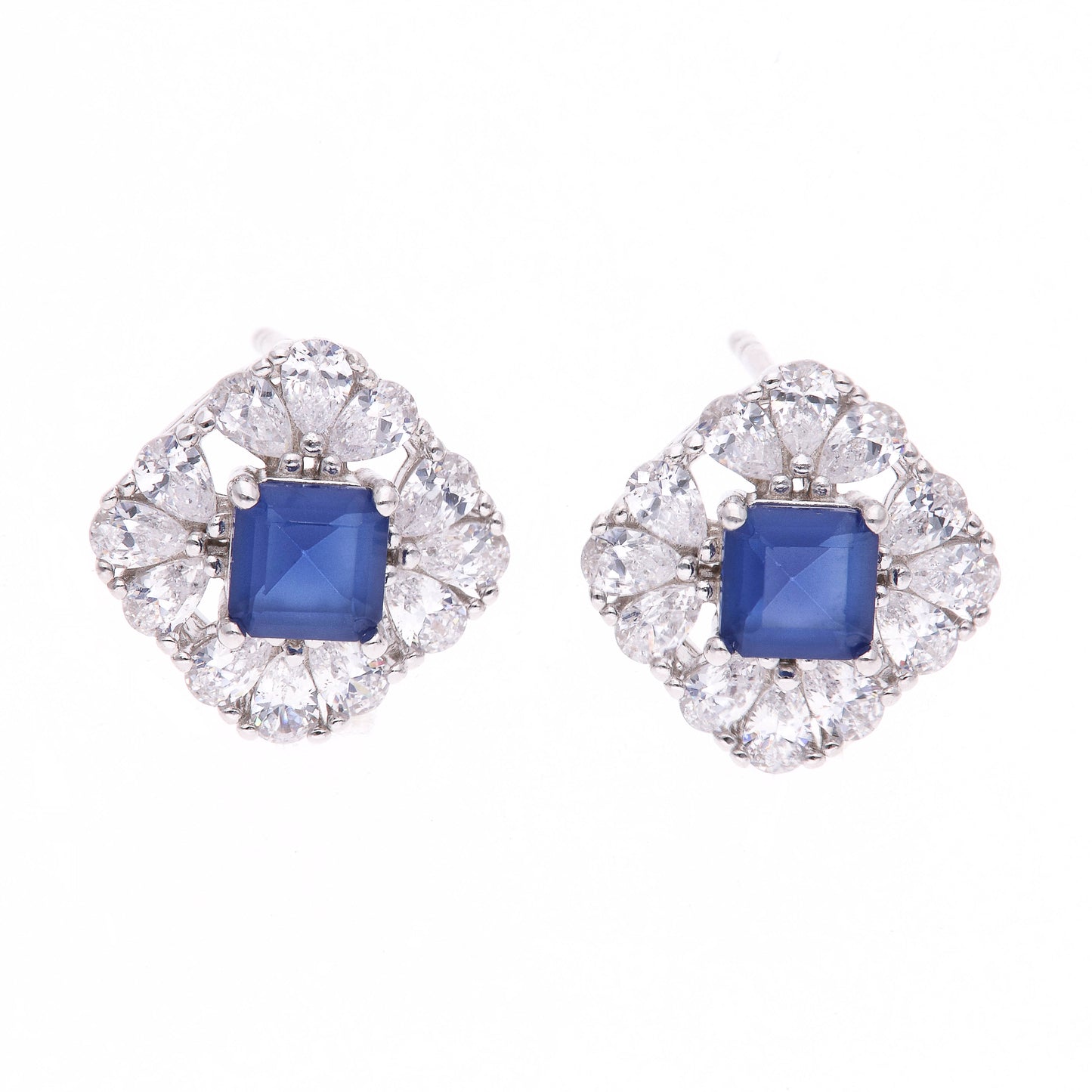 BROQUEL EN PLATA LEY .925, CON RODIO , ZIRCONIA AAA AZUL ZAFIRO Y BLANCO  , EN FORMA DE FLOR