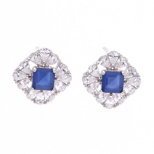 BROQUEL EN PLATA LEY .925, CON RODIO , ZIRCONIA AAA AZUL ZAFIRO Y BLANCO  , EN FORMA DE FLOR