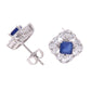 BROQUEL EN PLATA LEY .925, CON RODIO , ZIRCONIA AAA AZUL ZAFIRO Y BLANCO  , EN FORMA DE FLOR