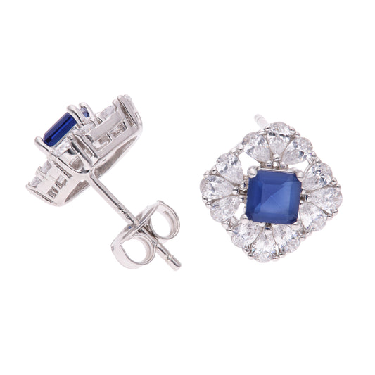 BROQUEL EN PLATA LEY .925, CON RODIO , ZIRCONIA AAA AZUL ZAFIRO Y BLANCO  , EN FORMA DE FLOR