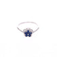 ANILLO EN PLATA LEY .925, CON RODIO , ZIRCONIA AAA AZUL ZAFIRO Y BLANCO  , EN FORMA DE FLOR