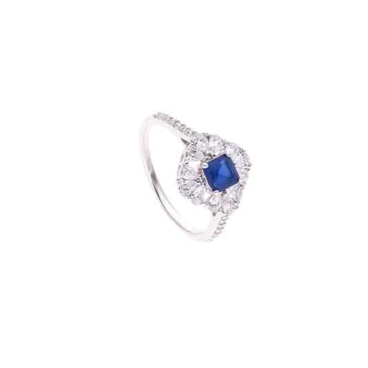ANILLO EN PLATA LEY .925, CON RODIO , ZIRCONIA AAA AZUL ZAFIRO Y BLANCO  , EN FORMA DE FLOR