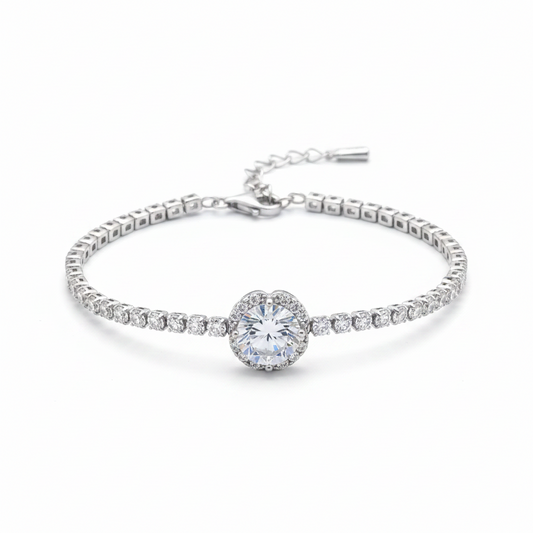 Pulsera tennis en plata .925 con cadena continua de zircones blancos y centro focal de zircón blanco grande con halo floral