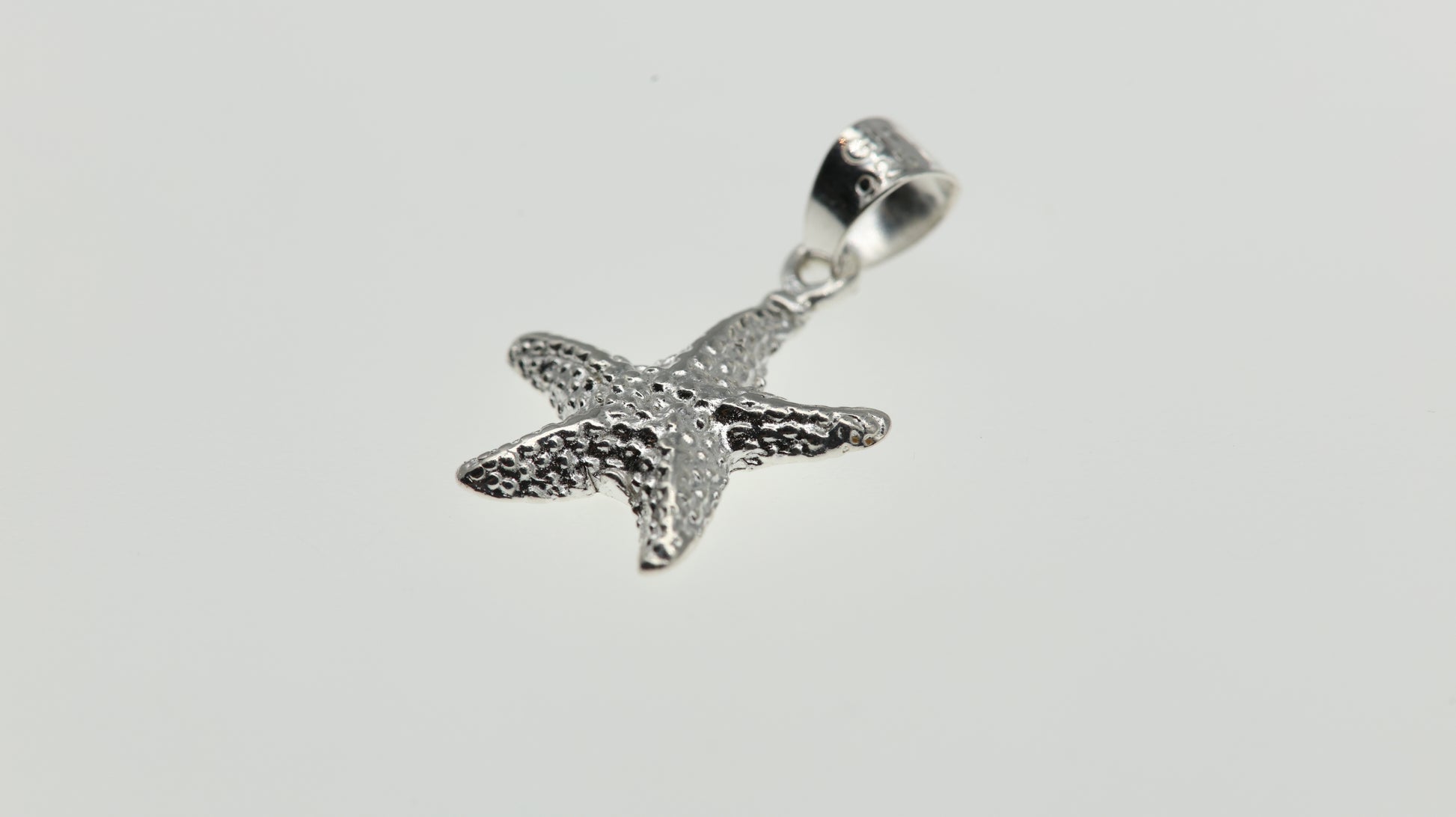 Dije en plata.925en forma de estrella-Linea Marina-00002
